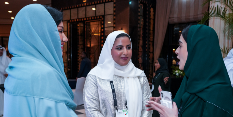 Visitors speak to an exhibitor at MEOS GEO 2025